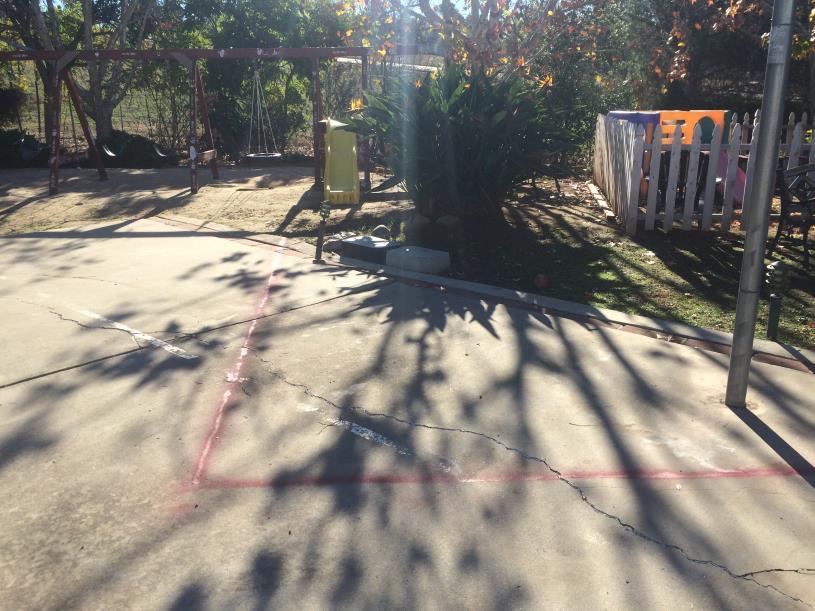 Photograph 2: Existing parking area, children s fenced in area, and playground showing disturbance.