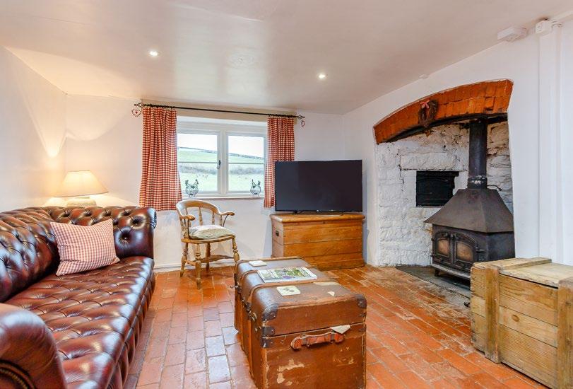 Helecombe Farm Clayhanger, Tiverton, Devon, EX16 7NY A well-presented 4/5 bedroom farmhouse with a three bedroom holiday cottage, a range of farm buildings and approximately 41.83 acres.