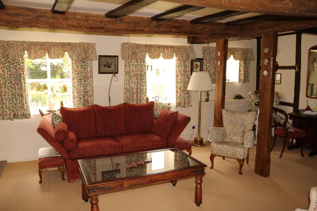 Sitting Room Off the Reception Hall further half panelled glazed doorway leads into Dining Room measuring approximately