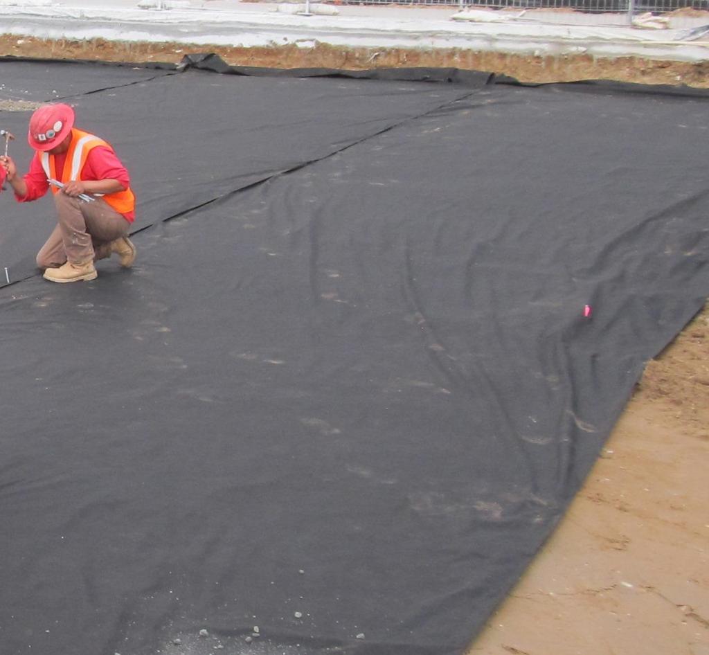 Install the geotextile fabric Place a layer of geotextile fabric over the compacted subgrade before placing the sub base aggregate.