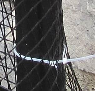 Attaching the geogrid Attach geogrid to posts with one