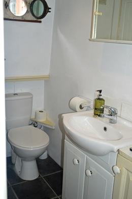 cupboard beneath. Sea toilet and spare Porta-Potti.