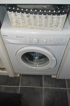 Other Features: Full height cupboard housing the Beko washing machine and