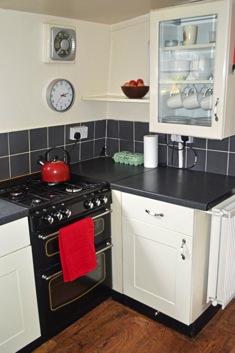 1 x double cupboard with drawer above beneath the sink. Cooker space.