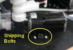 Remove the shipping bolts from the base of each pump and rotate the swivel lock, located at the rear of each pump,