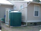 This method is a variation of a rain barrel set-up, but it involves a larger storage volume.