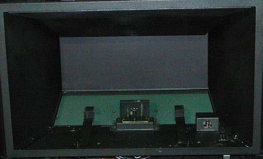 Figure 49: Carefully remove the front brick panel on the bottom of the firebox by lifting it up.