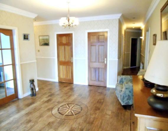 Entrance Hall: with twin cloaks cupboards, hot press, Amtico flooring,