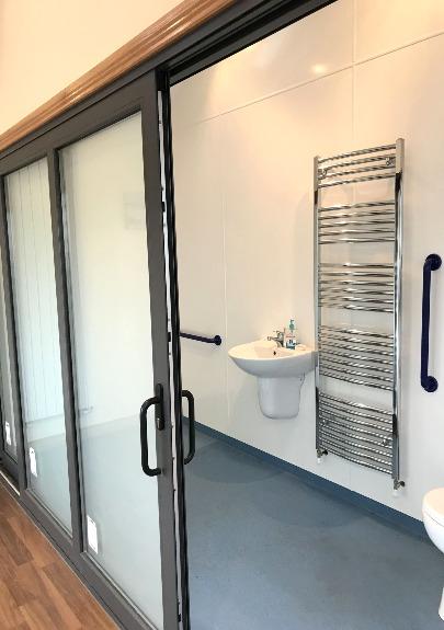 electric fittings, sliding aluminium doors leading to wet room.