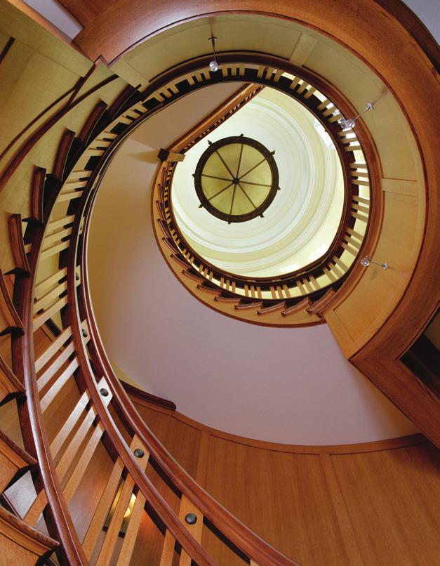 A dramatic view of the four-story circular staircase, topped