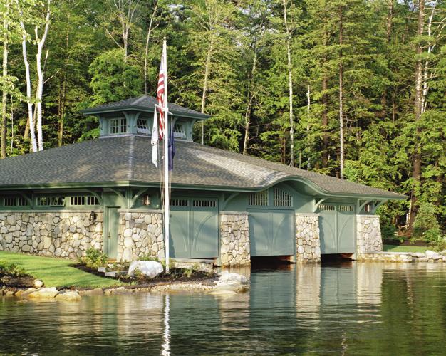 Befitting its lakeside location and the owners love of boating, a three-bay boat house compliments the architecture of