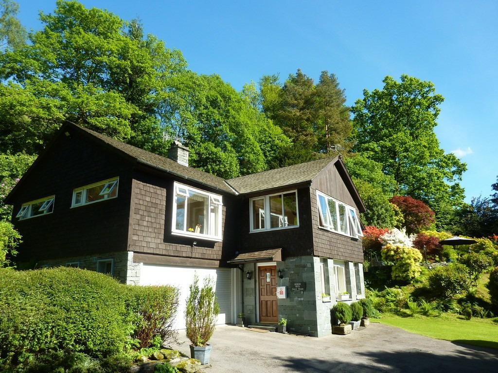 The property has a large private drive with parking for four to five vehicles