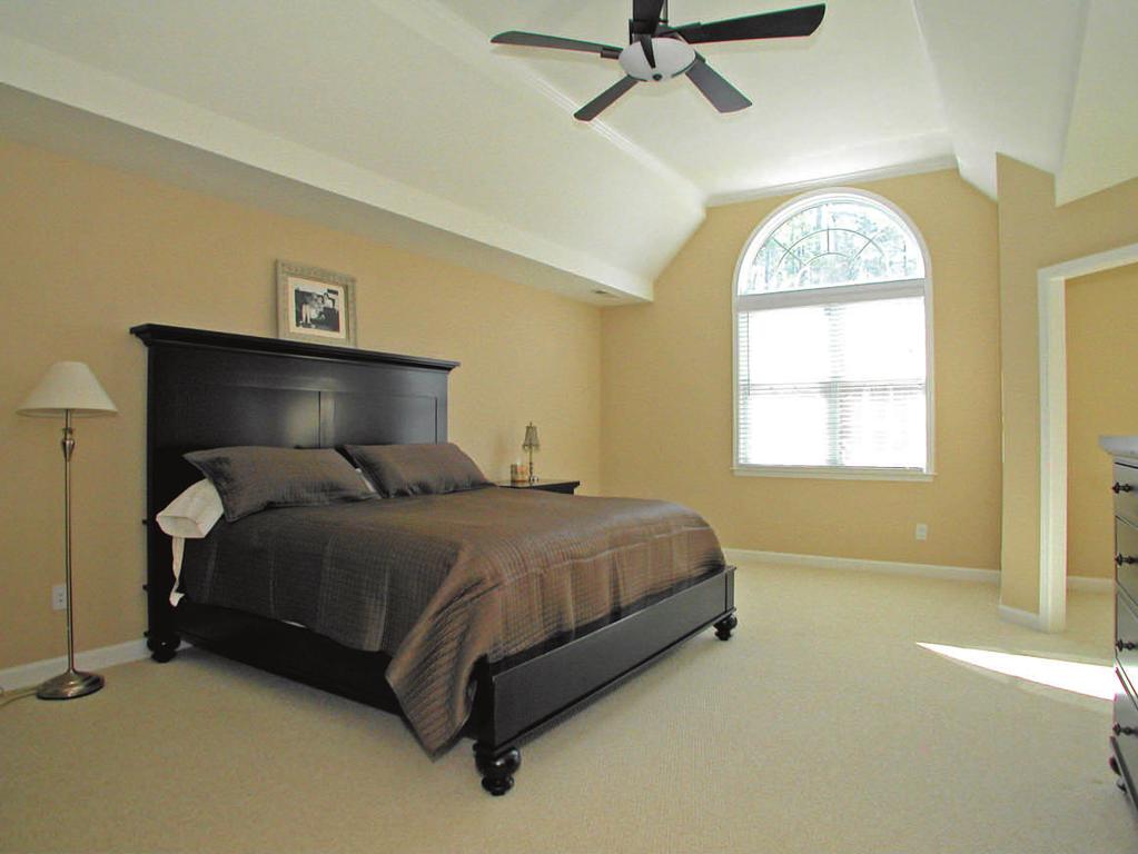 Double doors at the top of the second floor landing lead to the serene and spacious master suite