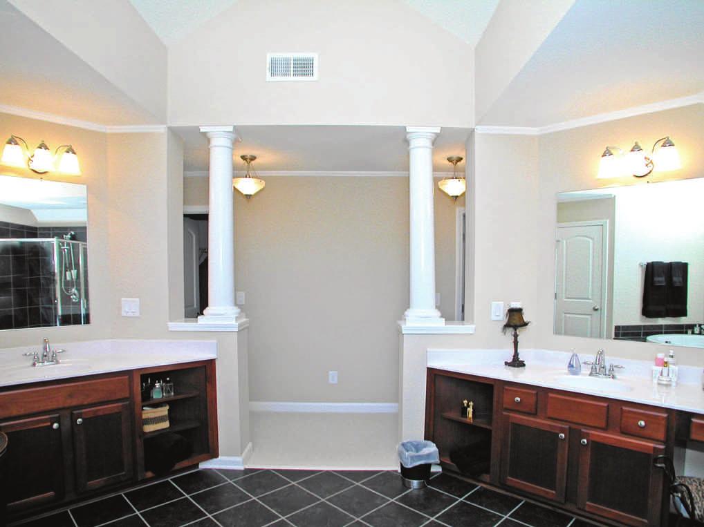 featuring ceramic tile surround and full-body massage shower His & Her vanities with cultured marble