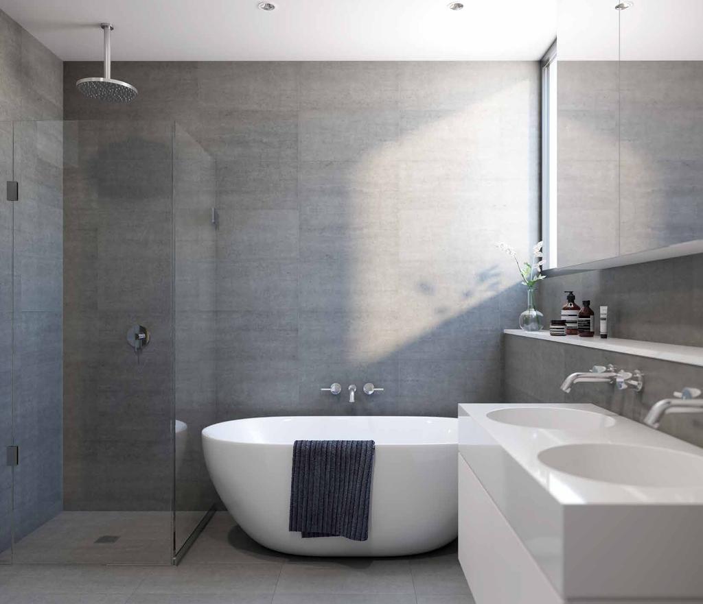 SPACE TO INDULGE Luxury abounds in the two generous bathrooms, featuring a timeless palette of soft grey