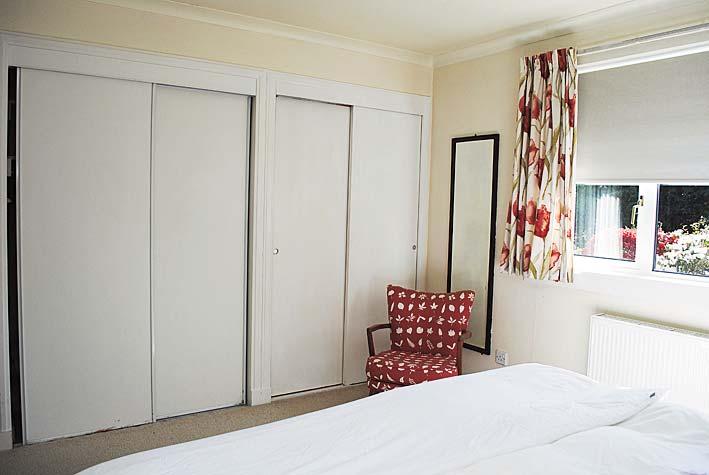 The bedroom window has a fitted curtain track, curtains and roller blind, ceiling light, fitted carpet. BT connection is available within the room.