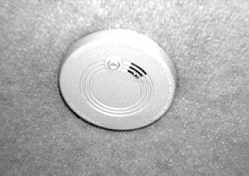 The smoke alarm is powered by a 9-volt battery and has a sensor that is designed to detect smoke. This alarm meets U.L.