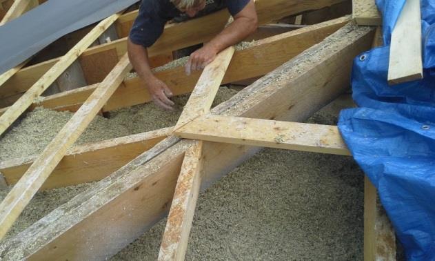 Hempcrete construction Bails of shredded hemp are mixed 4:1 with hydrated lime and clay in this vertical shaft mixer.