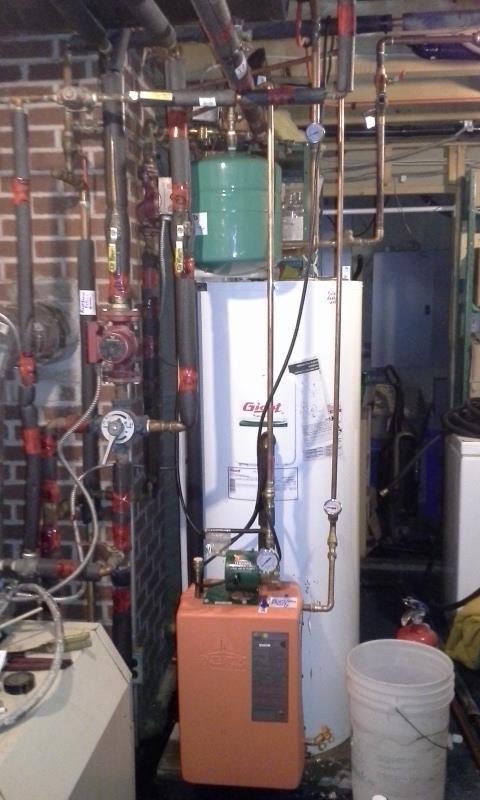 The system Total budget:$4500 The Thermodynamics heat exchanger and 12 volt pump module has two copper cylinders within.