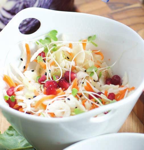 Thai Style Slaw INGREDIENTS 2 large carrots 1 small white cabbage, cored and cut handful of microgreens 2 tbsp pomegranate seeds 1 tsp fresh ginger, minced 1 tbsp peanut oil ¼ cup rice vinegar 1 tbsp