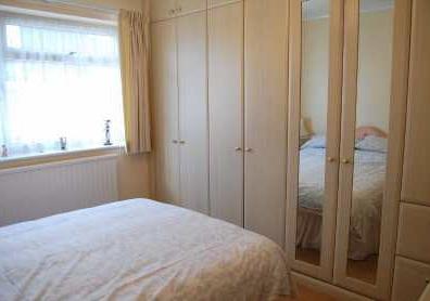 BEDROOM 2 3.45m x 3.13m (11'4" x 10'3") Including range of fitted wardrobes with shelves and drawers, radiator.