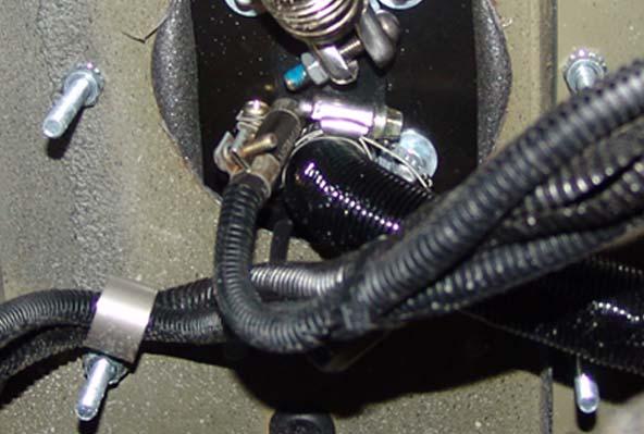Connect the remaining section of fuel line to the outlet end of the fuel pump using the fuel line coupler and clamps.