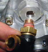 2 Install 1/4 NPT to 3/8 swivel tube fitting (Item 8) into purge port fitting on