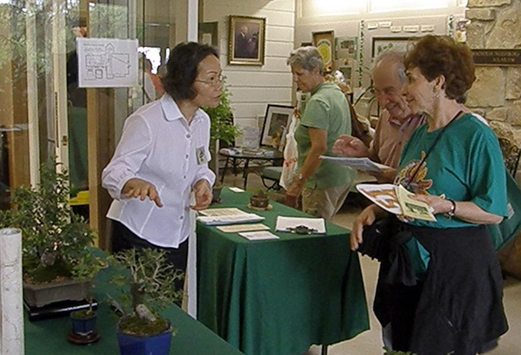 Sunny Huang talks to the public about Bonsai at the Educational