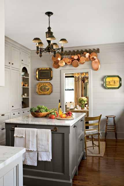 Tour the Space Check out the small changes that made a big difference in the Merediths home. we love this! Add age to a new kitchen by displaying favorite collections, such as copper pots.