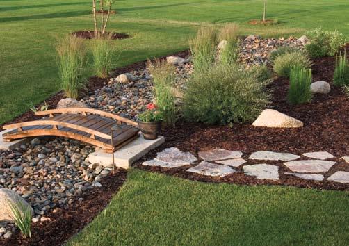 Above Top: The Wisconsin Chilton fieldstone is also used to create charming paths that lead to the creek bed. Roughcut limestone is used as the base for the wooden bridges.