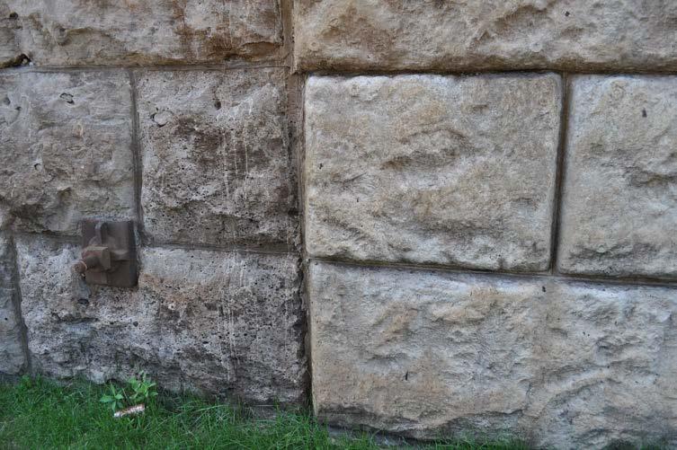 Figure 8: Detail showing the original stone with metal tie (left) and the newer addition (right). (CU, 2015) 10.