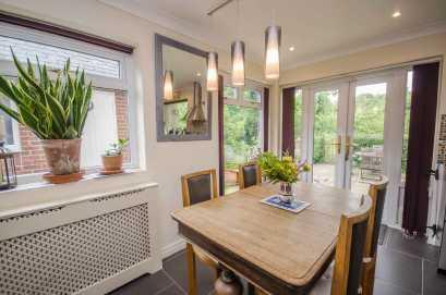 surface areas, provision for wall mounted flat screen television and UPVC double glazed window with views overlooking the rear garden and wildlife ponds providing a picturesque backdrop Open-plan to