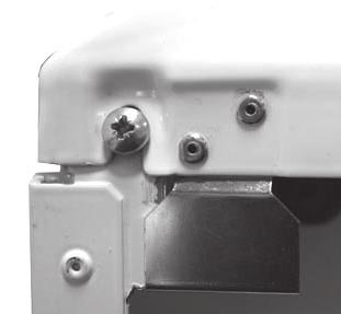 Re-tighten the two retaining screws. FRONT PANEL REMOVAL 1. Loosen the two screws retaining the front panel. 2.