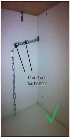 The chains then need to be pulled as tight as possible from inside the cabinet using a self drilling wood screw.