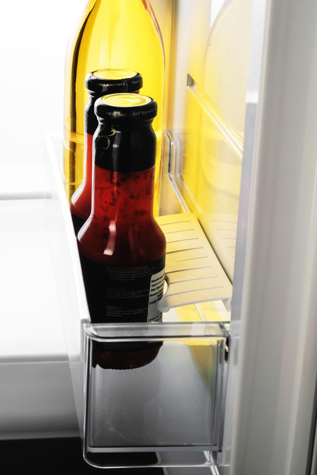 Often we struggle to keep the milk carton or a small bottle of sauce intact in the refrigerator. During the opening / closing of the door these bottles / cartons gets displaced or even fall.
