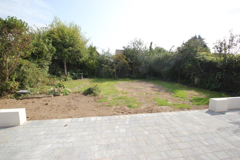 GARDEN With cobble style block paved patio to the immediate rear, extending to both sides of the property.