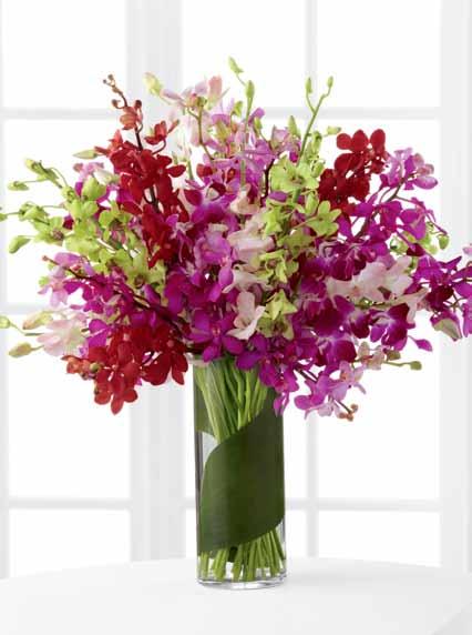 Flowers say it better. ftd says it best. extraordinary design the ftd luxury collection modern treasures A triumphant mix of exceptional lilies bursts from our towering glass vase.