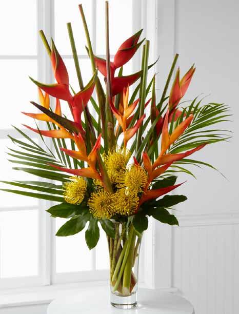 It s set in a beautifully crafted, flared glass vase that accentuates the extravagance of the bouquet.