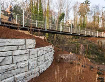 Spirit Trail Overpass: a tilted steel tied arch superstructure, selected to optimize structural depth, which minimizes approach pathway embankment costs.