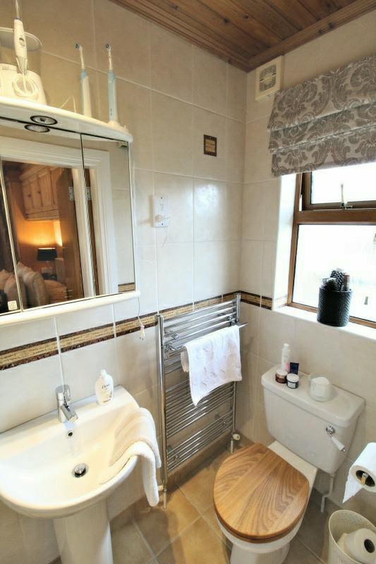 Ensuite: comprising; fully tiled walk in double