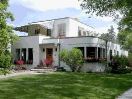 popularized by Hollywood movies of the 1930s. Flat roofs, metal window casements, and smooth stucco walls with rectangular cutout mark the exteriors of Art Deco homes.