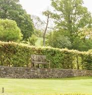 Gardens and Grounds The property is approached over a sweeping drive between a gated entrance leading to a large