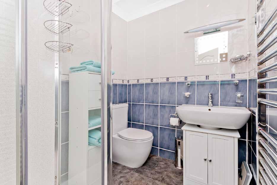 full height heated chrome towel rail. Owing to its desirable corner plot, the house boasts excellent external space.