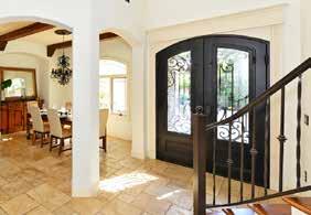 COVERED ENTRY Size: 6 9 x 6 6 Stained cypress wood ceiling Wrought