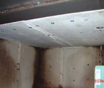 Particular care was taken so that all ceiling and partition wall seams were filled with chemically-setting type joint compound to prevent leakage into the interstitial space between the ceiling and