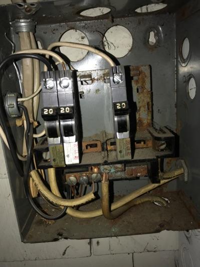 This is not an allowable installation, recommend conditions are investigated further and corrected by licensed electrical contractor.
