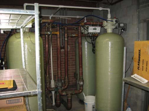 An Ecowater water softener is located in an adjacent space. It was installed 4 to 5 years ago. Maintenance staff reported that this serves the entire building. It is in good condition.
