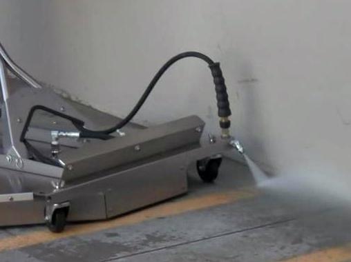deluxe surface cleaner. The dual trigger guns activate either the stainless rotary spray arm or one of the other three devices.
