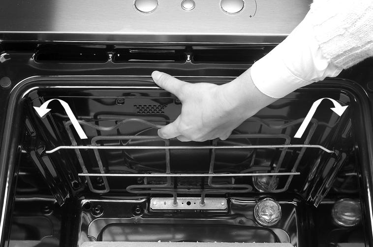 Lower the two catches. 3. Close the oven door fully.