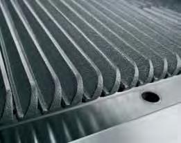 The inclined position incorporates a flare reducing grate fin design, with grooves, to run grease into a front collection channel.
